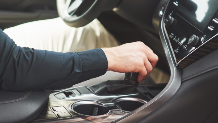 Man Driving a Manual Car